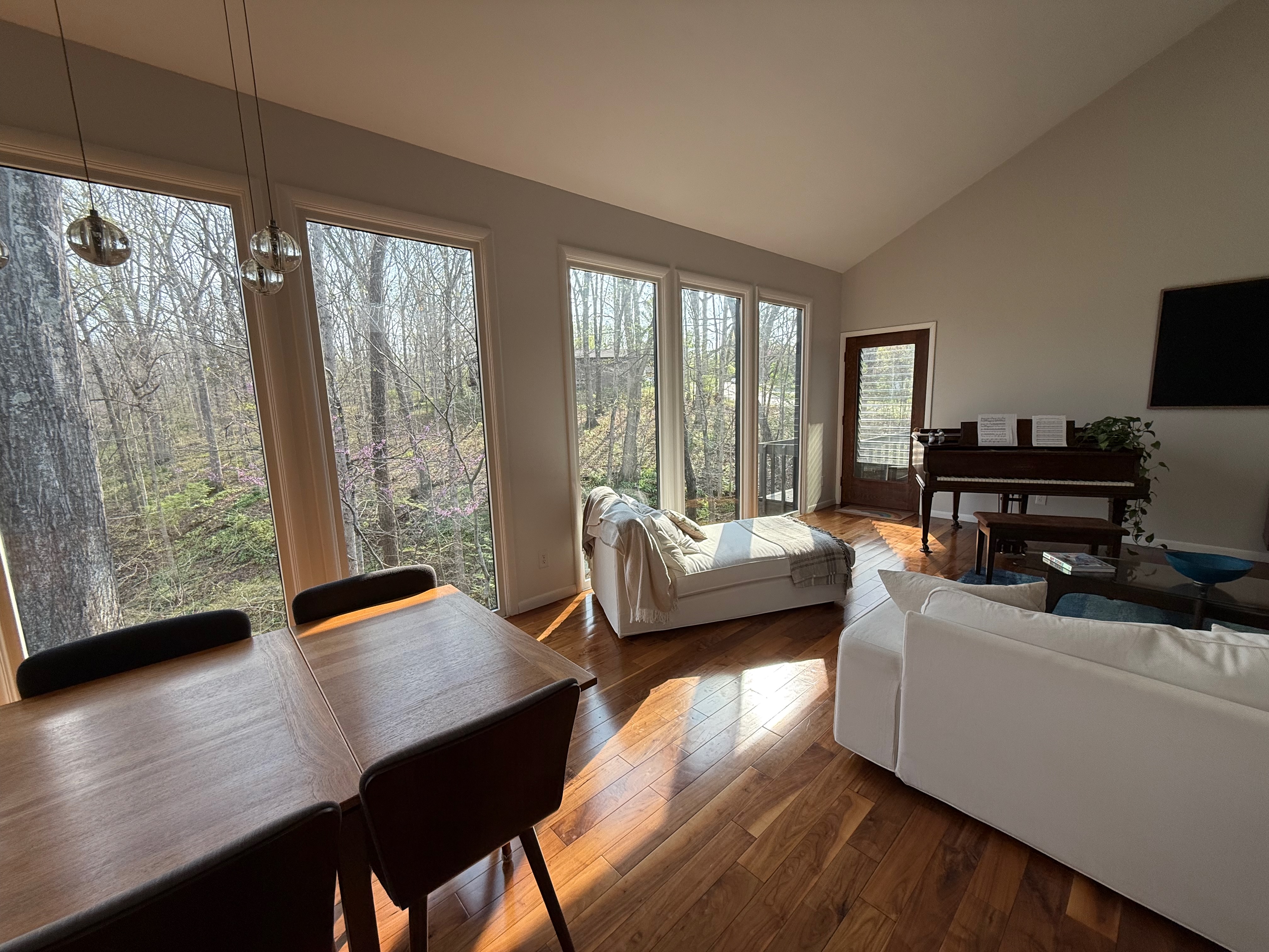 Living room looking out to wooded ridge